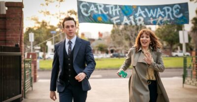 Katherine Parkinson smiles while Rowan Witt looks serious in a suit on Spreadsheet