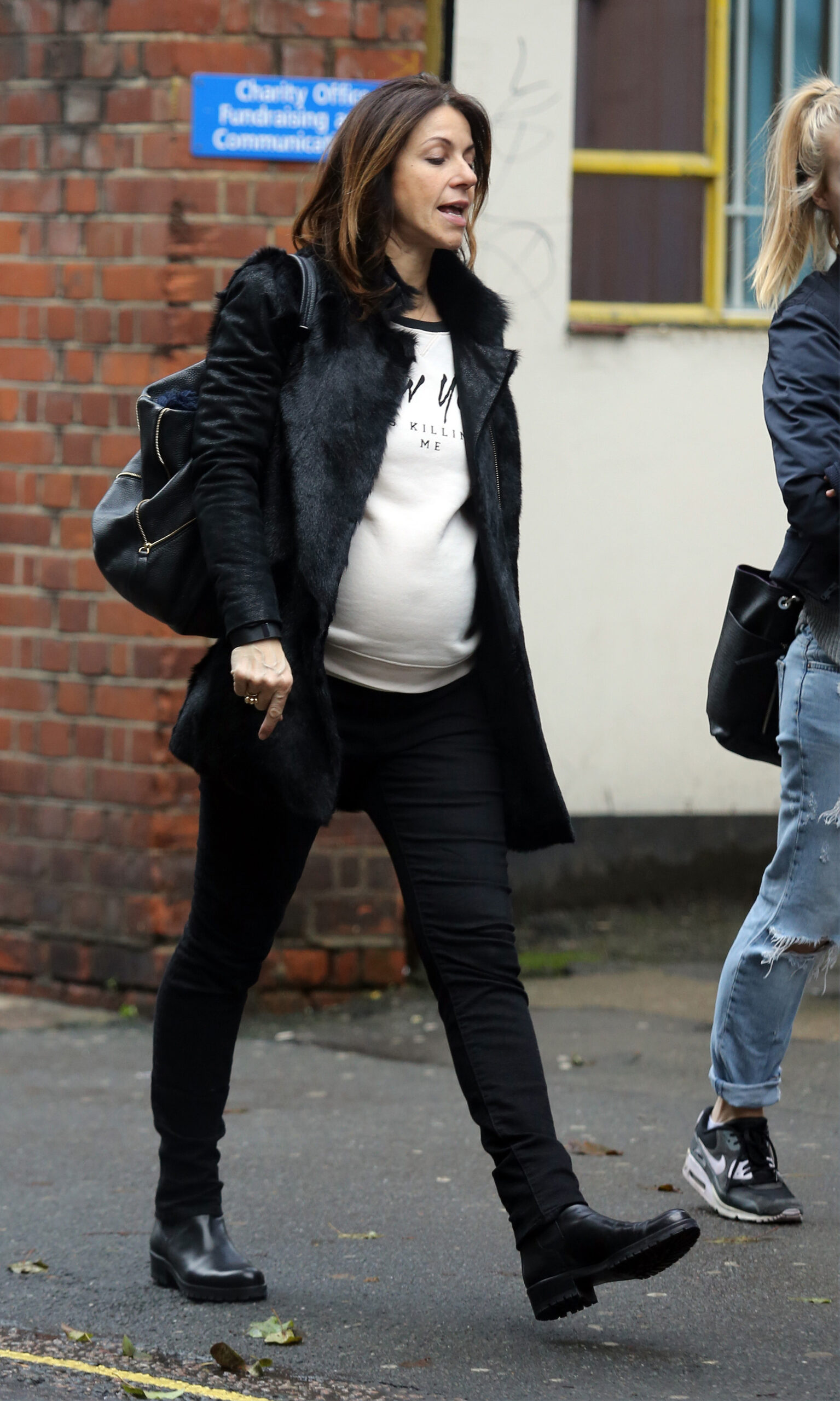 Julia Bradbury heavily pregnant walking along the street