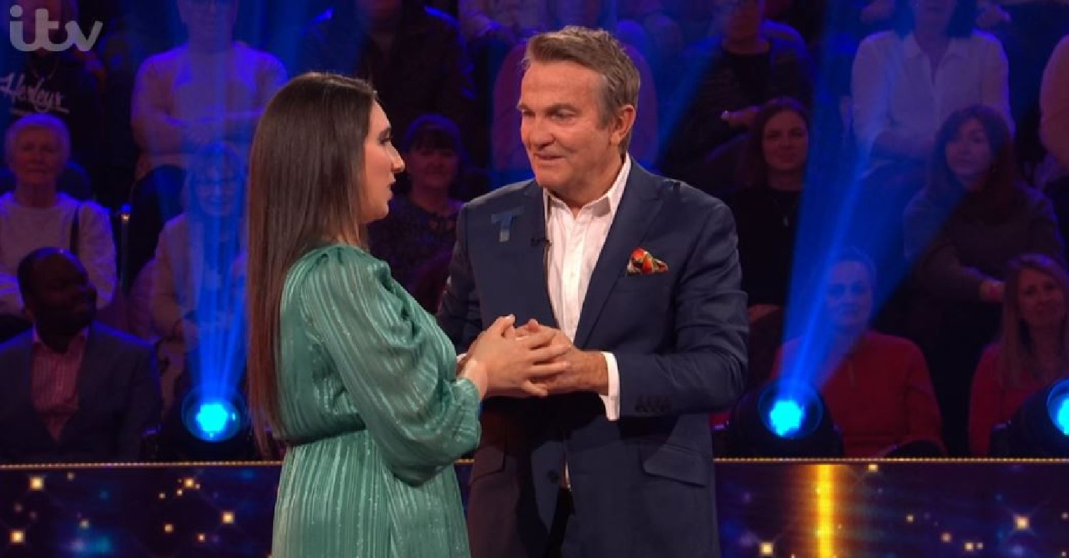 Beat the Chasers 2022 contestant holding hands with Bradley Walsh after win
