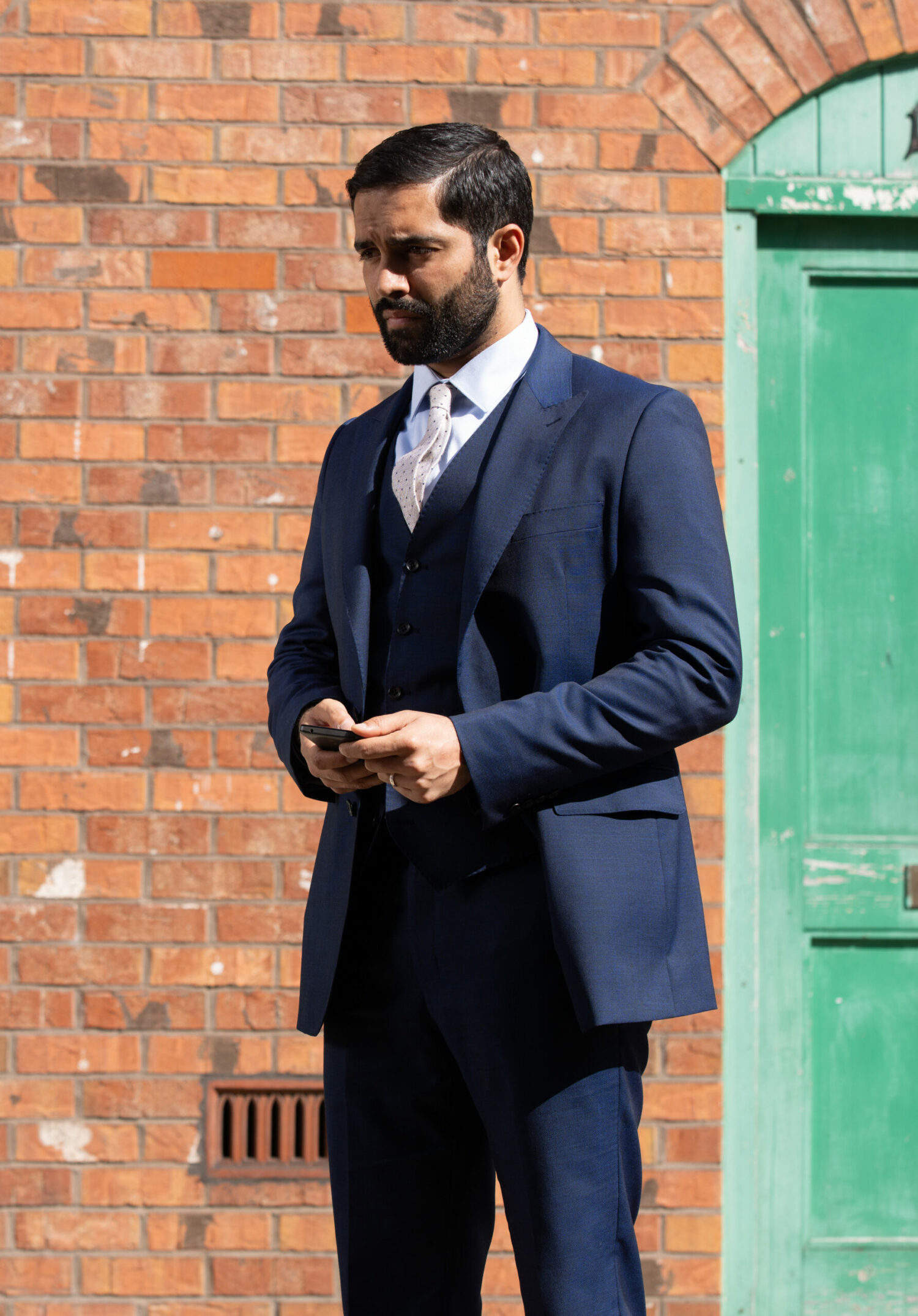 Coronation Street Imran clearly feels guilty as he makes a phone call