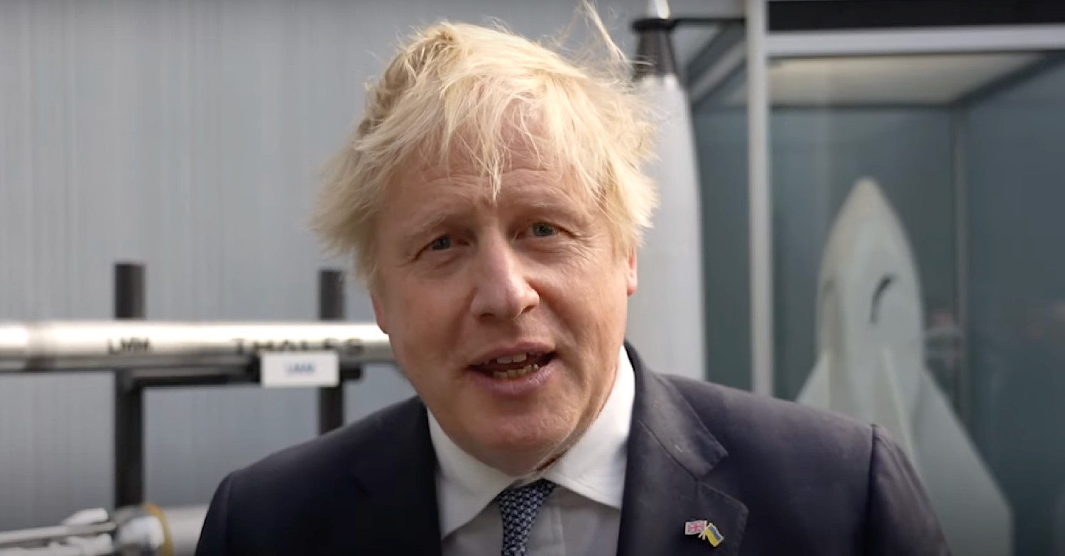 Boris Johnson smiling and talking to camera