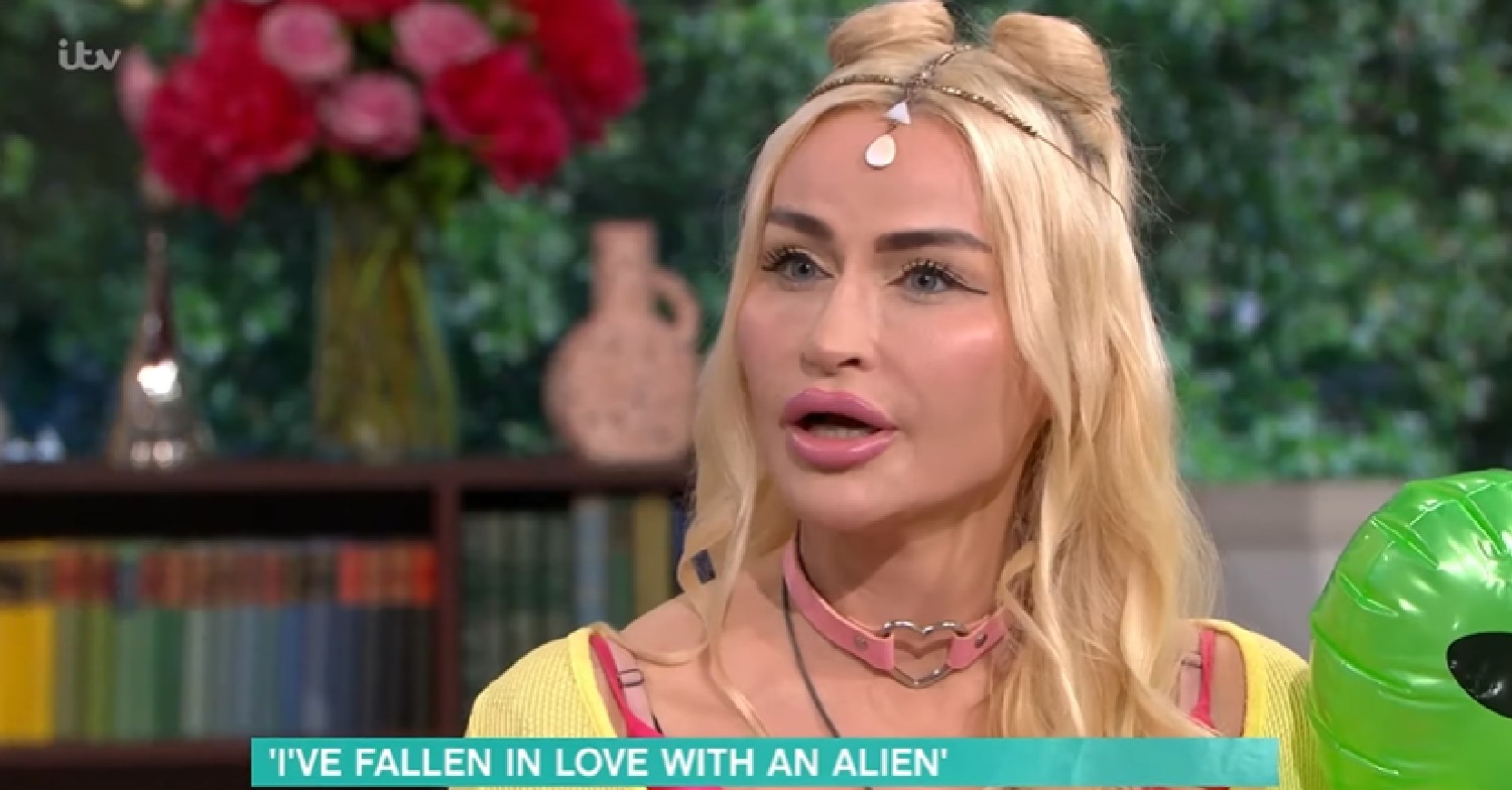 This Morning guest speaking on show while holding inflatable alien