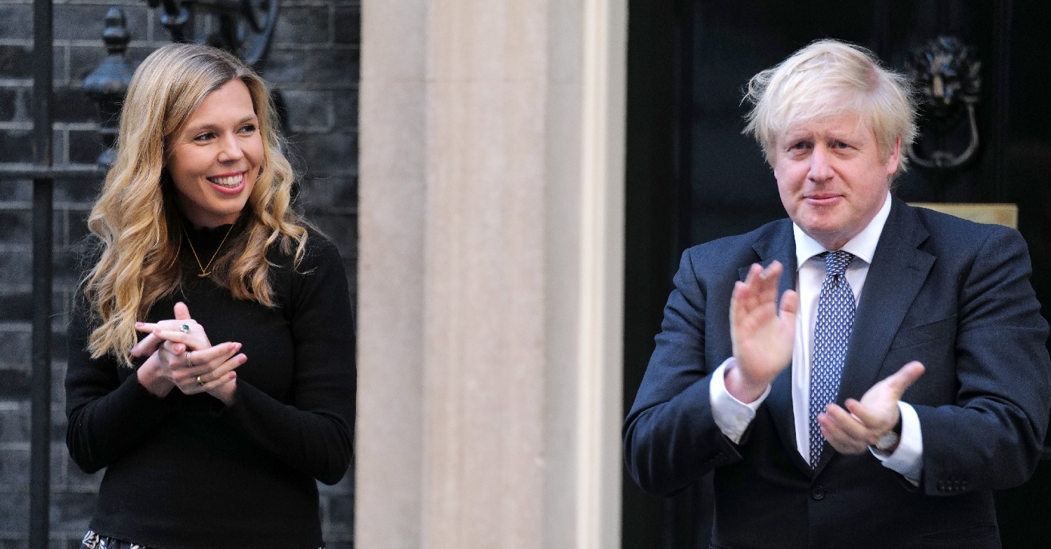Carrie Johnson and Boris Johnson smiling and clapping outside No.10 for the NHS