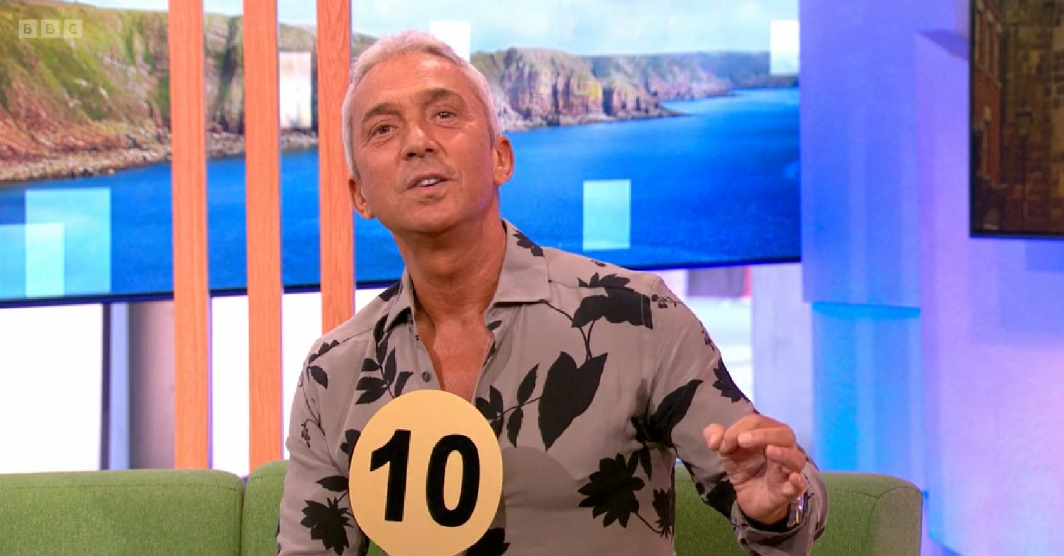 Bruno Tonioli talking and holding Strictly number 10 paddle on The One Show