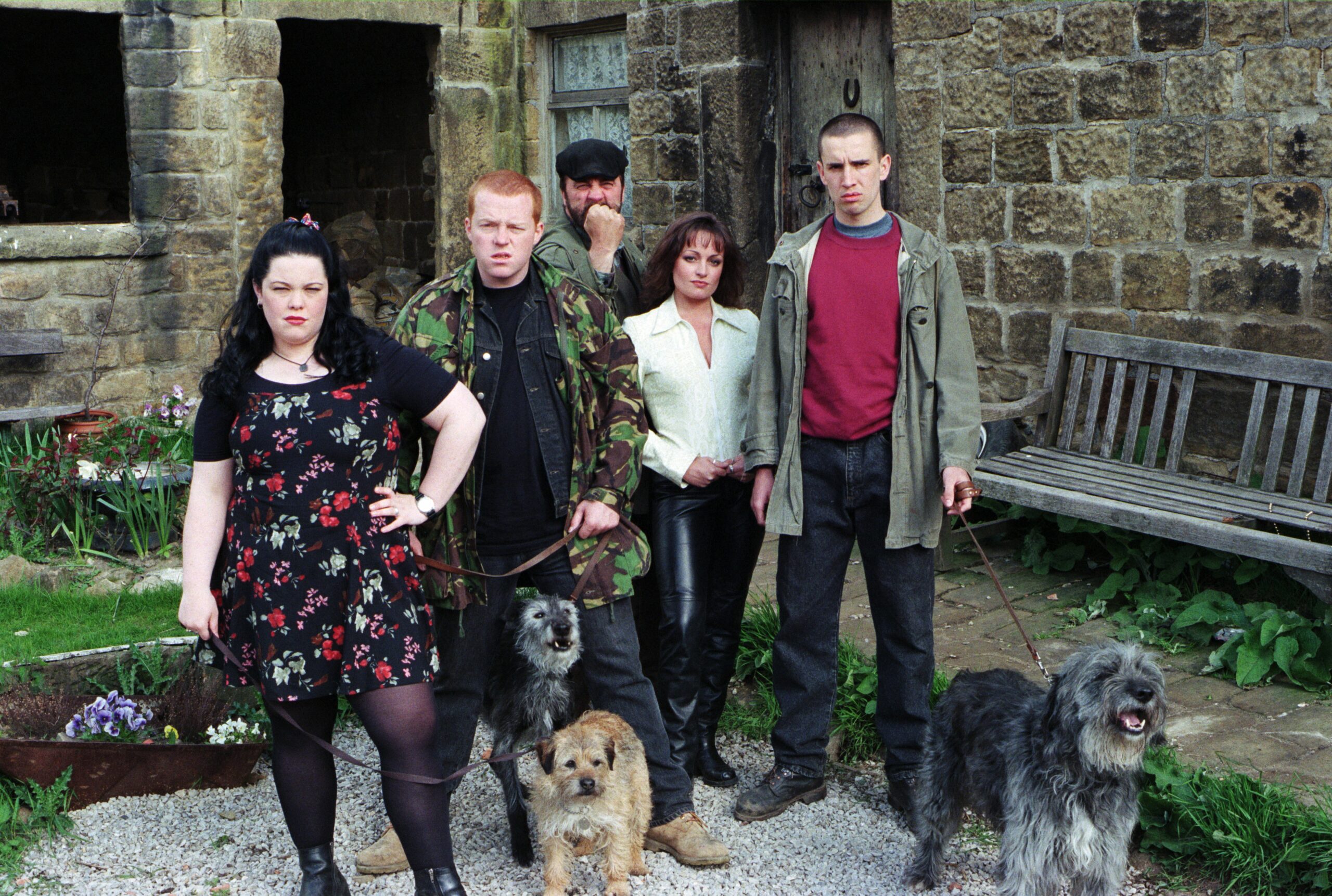 The Dingle family look menacing with their dogs in 1996