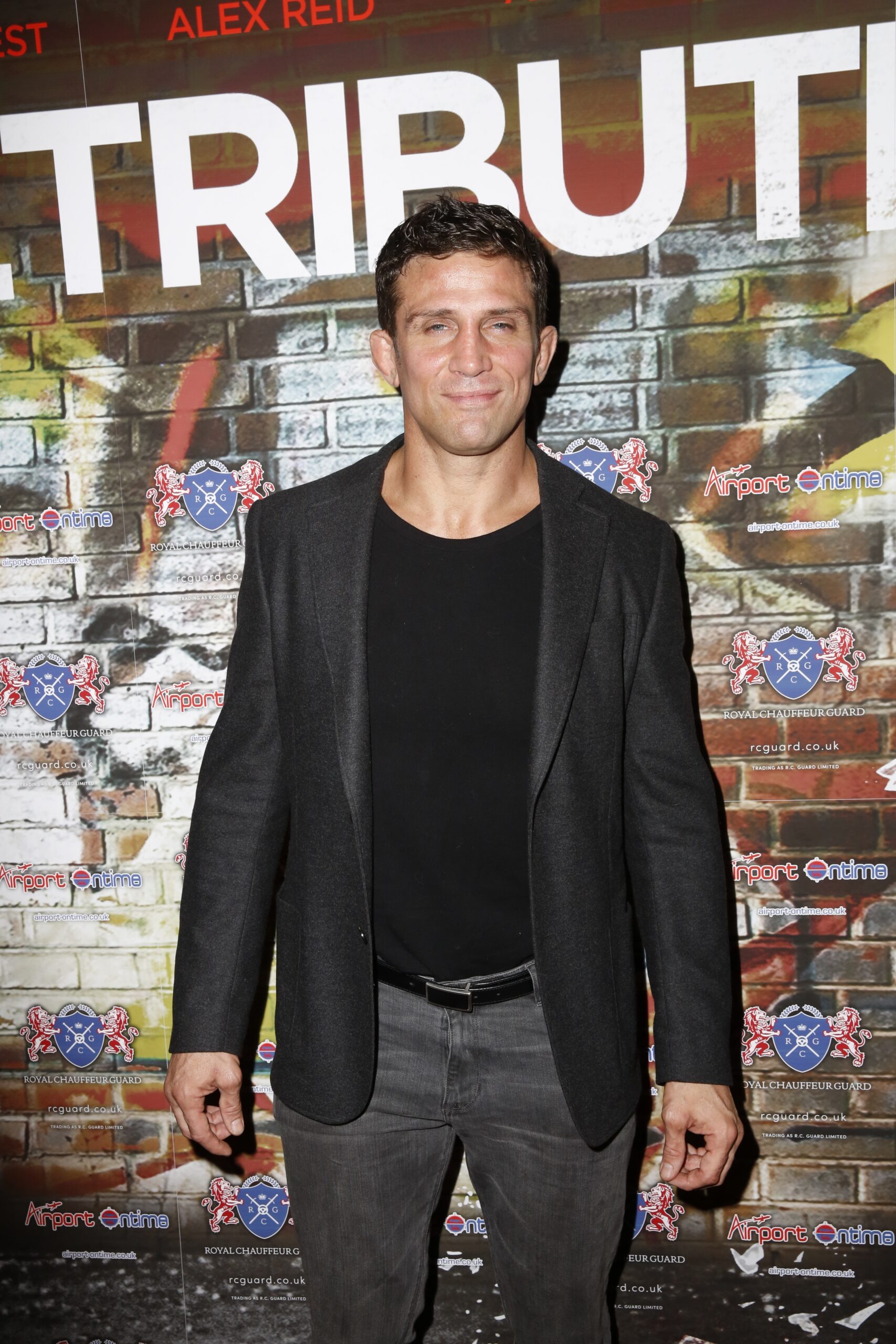 Alex Reid looking smug on the red carpet of an event