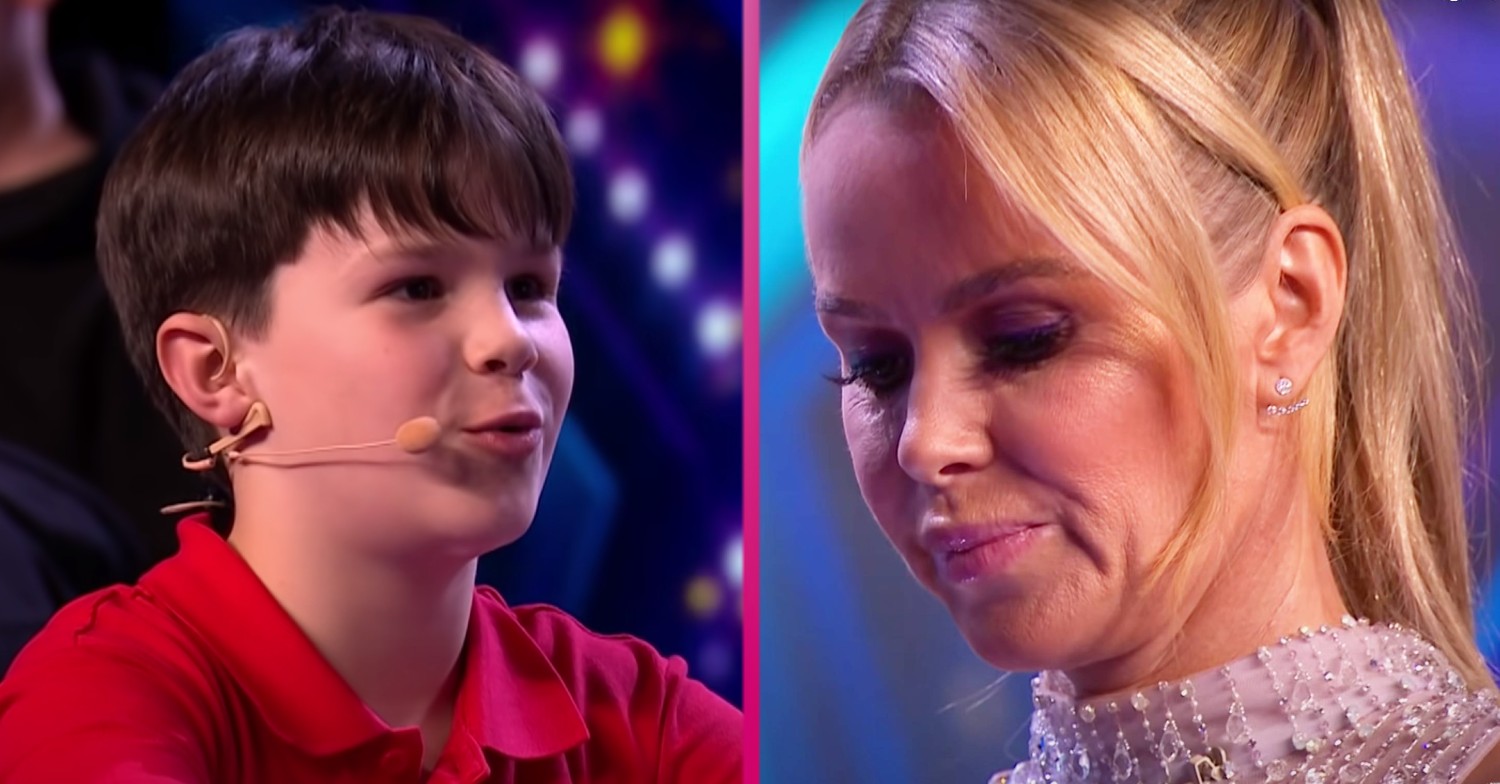 BGT star Amanda Holden on stage with a young magician