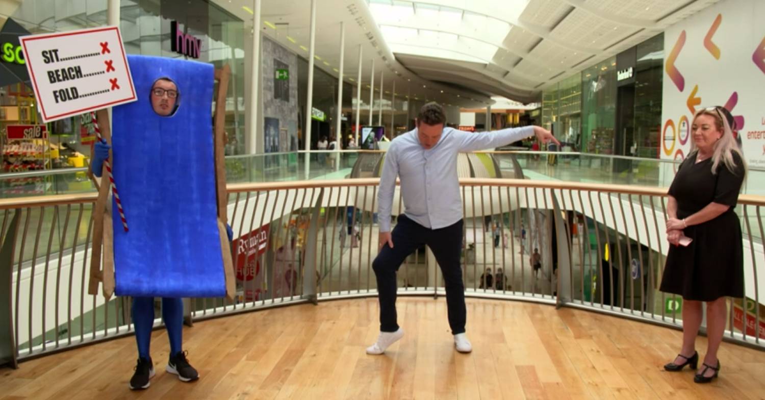 Stephen Mulhern dances during a game on In For A Penny
