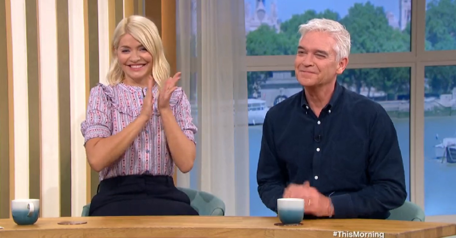 Holly Willoughby excitedly claps her hands alongside a smiling Phillip Schofield on This Morning on May 23, 2022
