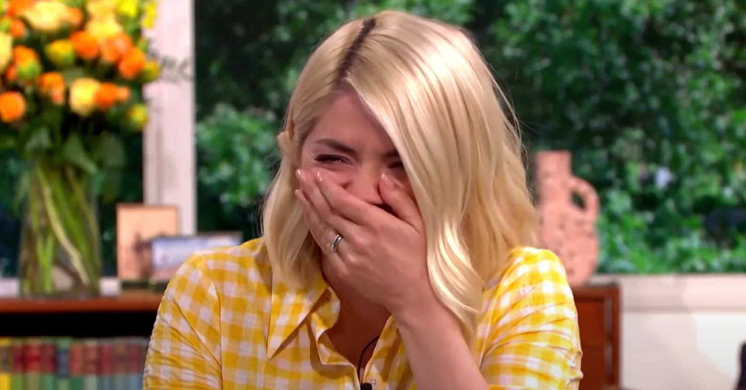 Holly Willoughby puts her hand to her mouth as she laughs on This Morning