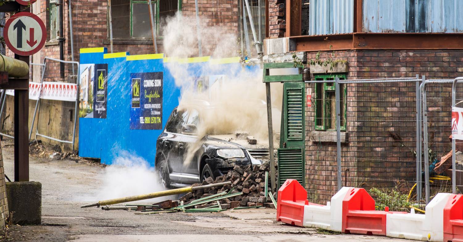 The crash causes dust to cover the car
