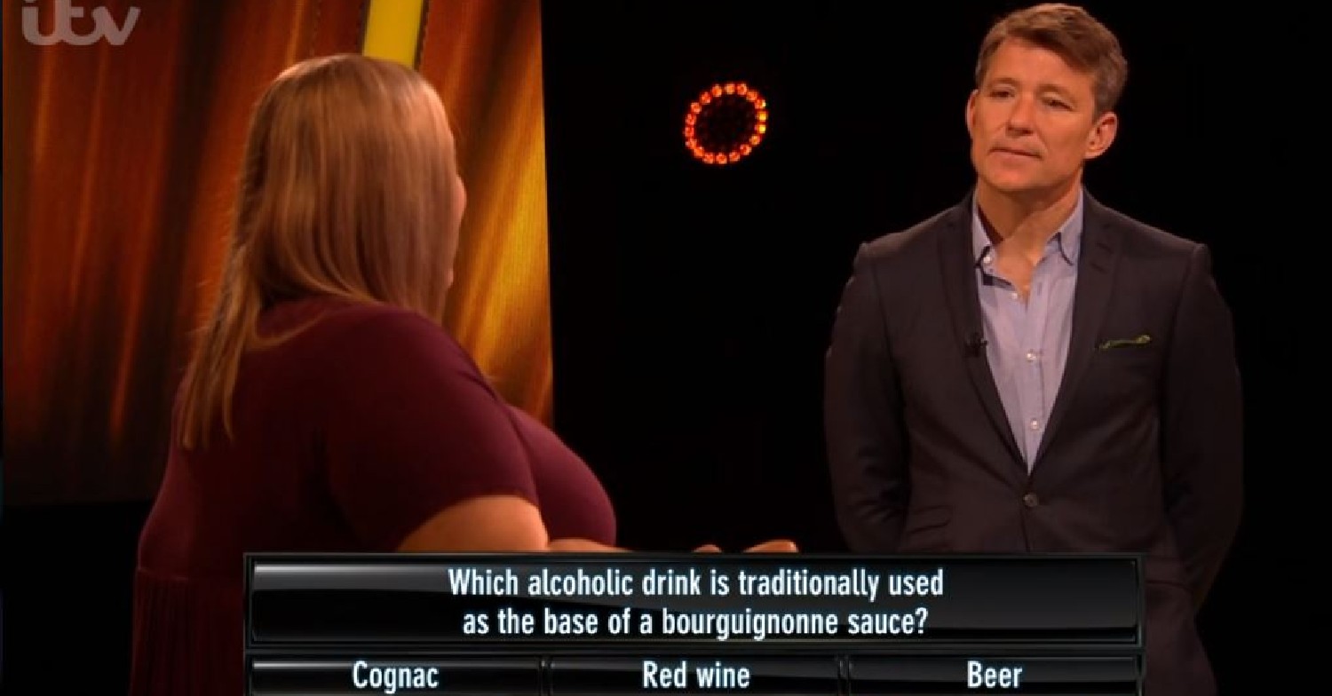 Ben Shephard talking to Claudia, who has her back to camera, on Tipping Point