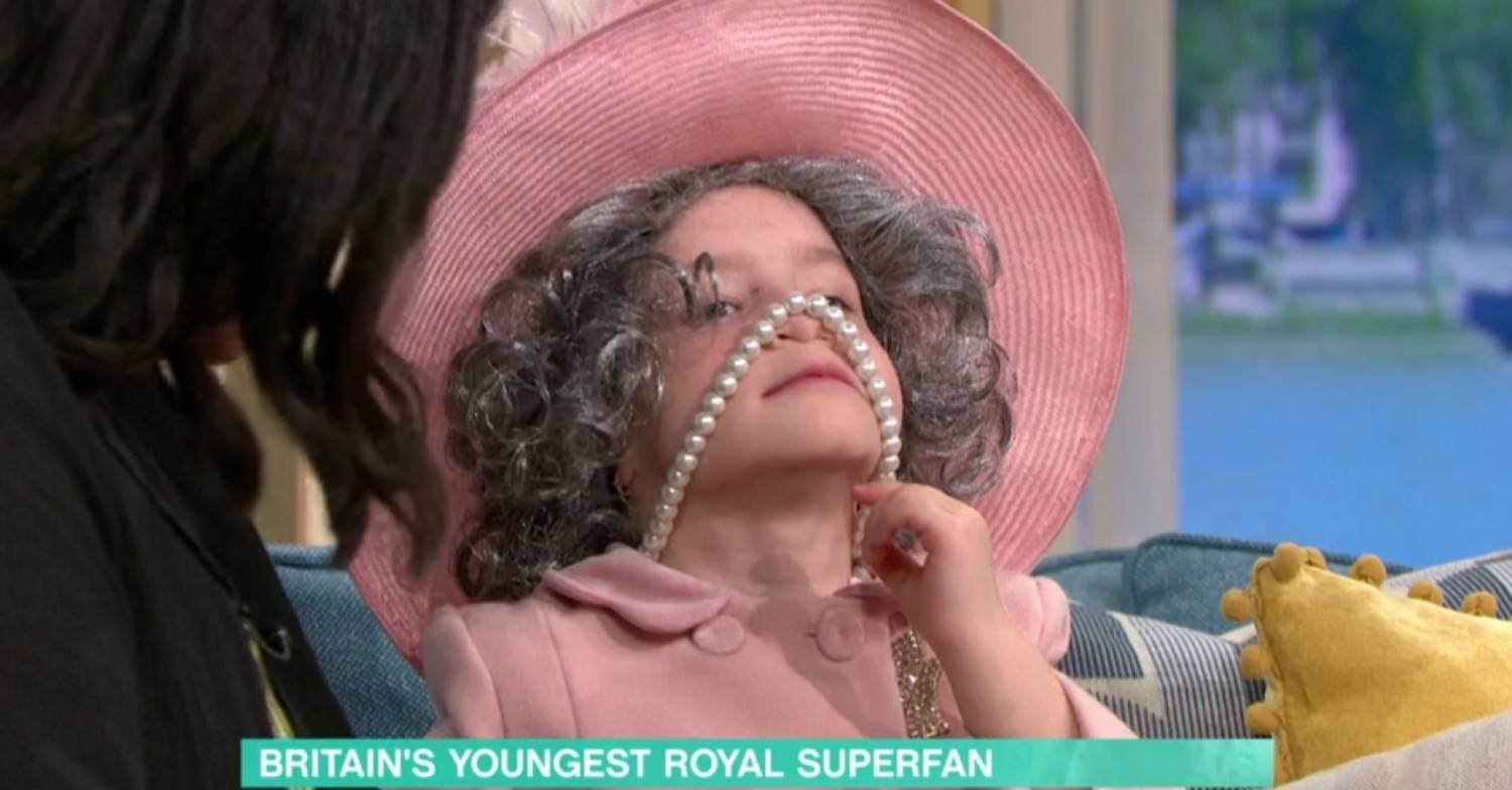 Isla plays with her necklace while dressed as the Queen on This Morning today