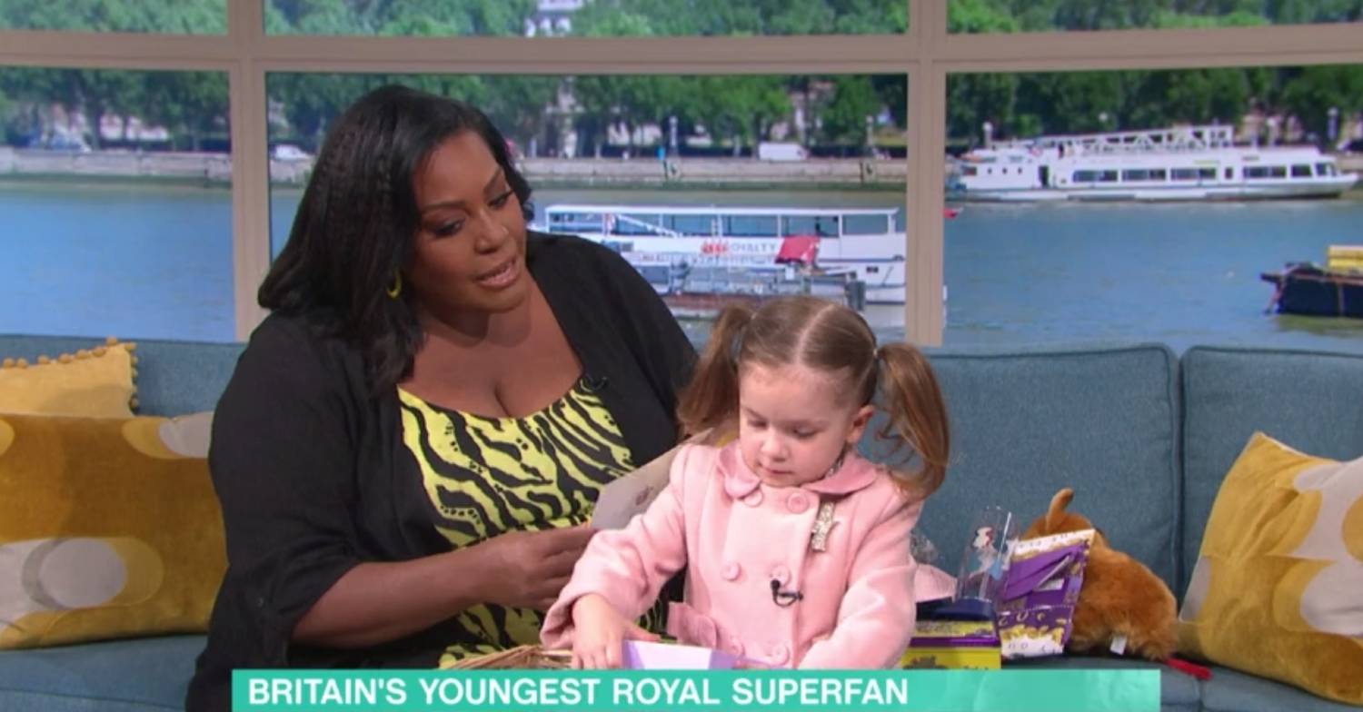 Isla seems more interested in her gifts than being dressed as the Queen on This Morning today