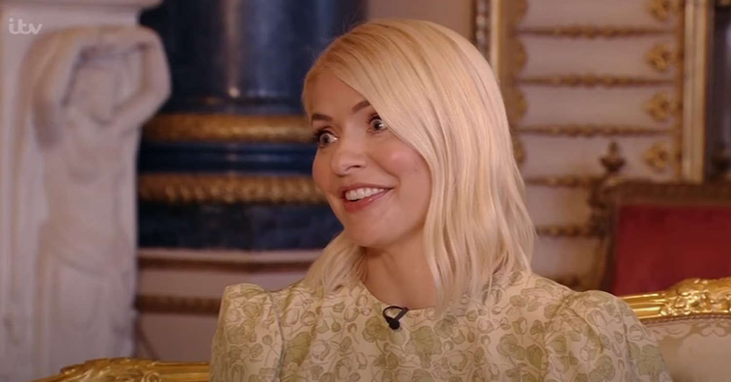 Holly Willoughby smiles in yellow dress on This Morning today at Buckingham Palace