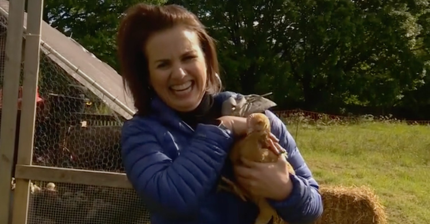 Nina Warhurst laughing and holding a chicken on BBC Breakfast today