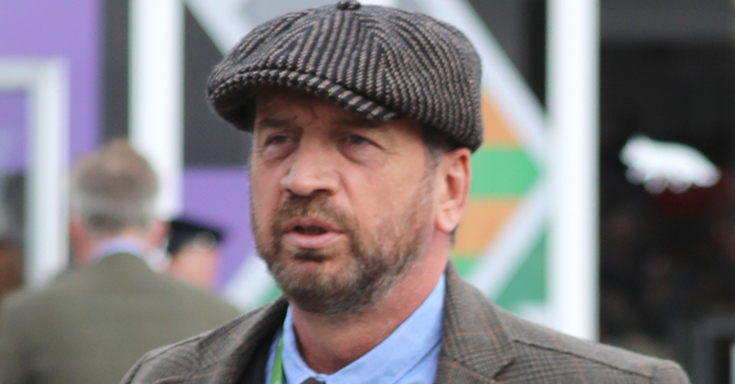 Nick Knowles looks serious in suit and hat at Cheltenham Races