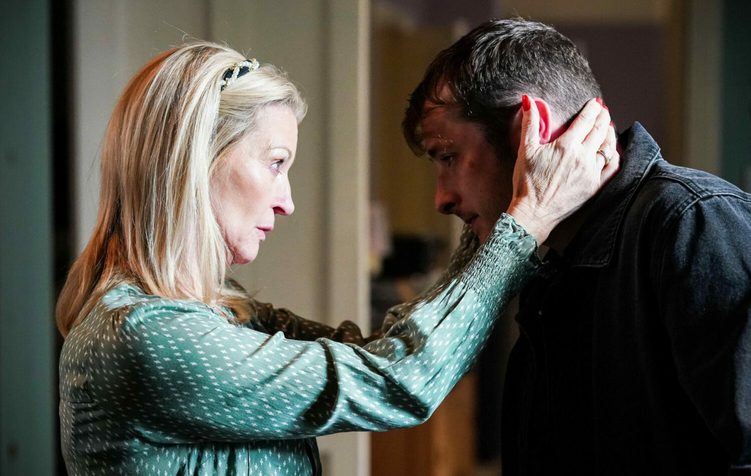 Kathy Beale puts her hands on her son Ben Mitchell's face as she realises he was raped