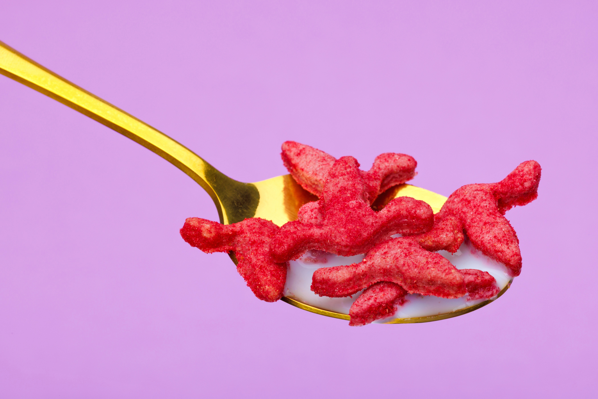 Close-up of Menstrual-themed breakfast cereal Period Crunch on a spoon