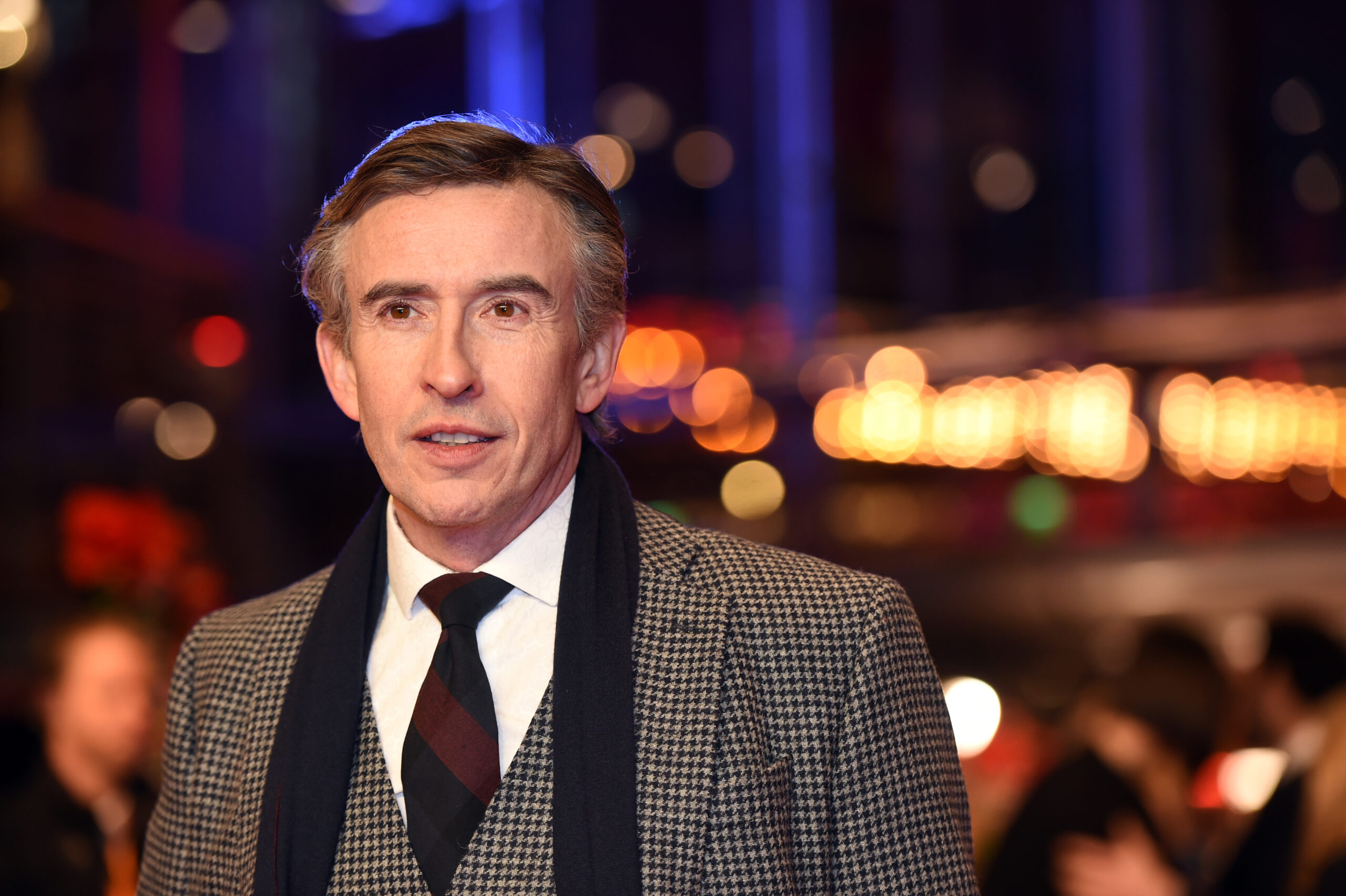 Steve Coogan in a suit on red carpet