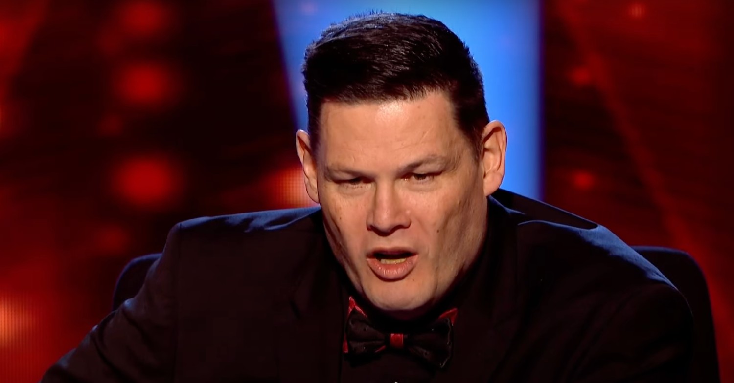 Mark Labbett frowning and speaking on The Chase