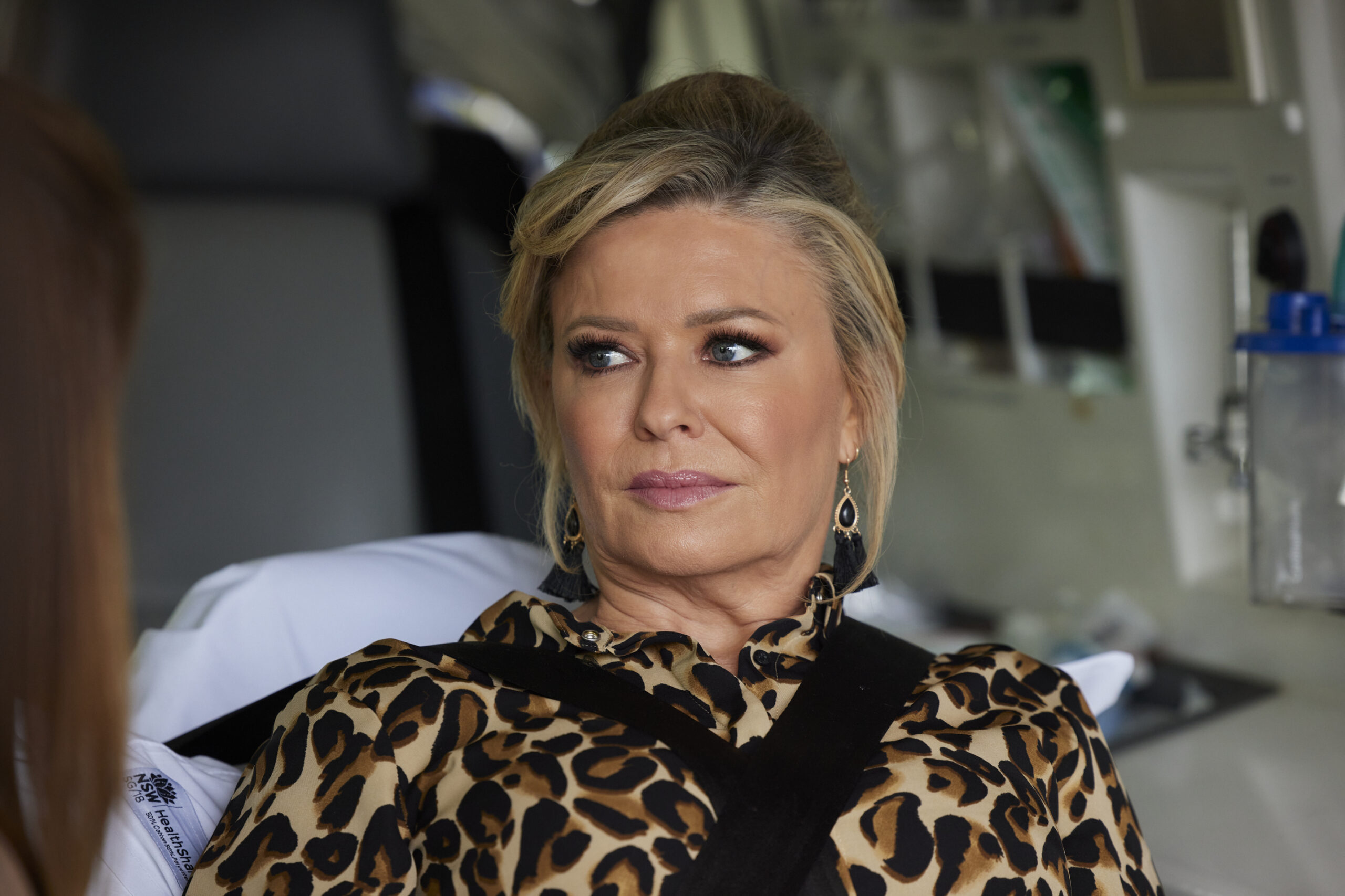 Marilyn Chambers in Home and Away looks worried as she can't feel her legs in a hospital bed