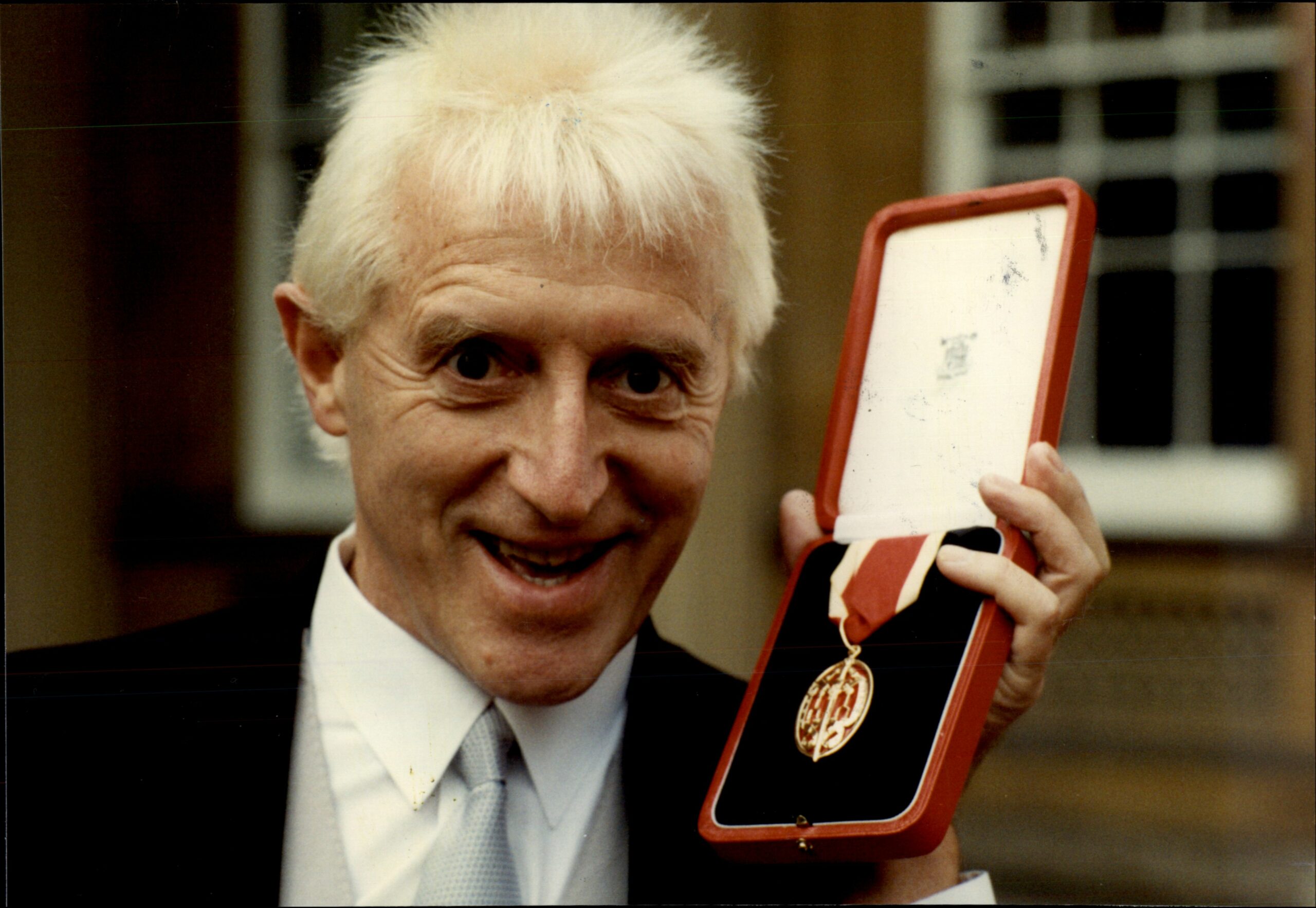 Jimmy Savile with his Knighthood