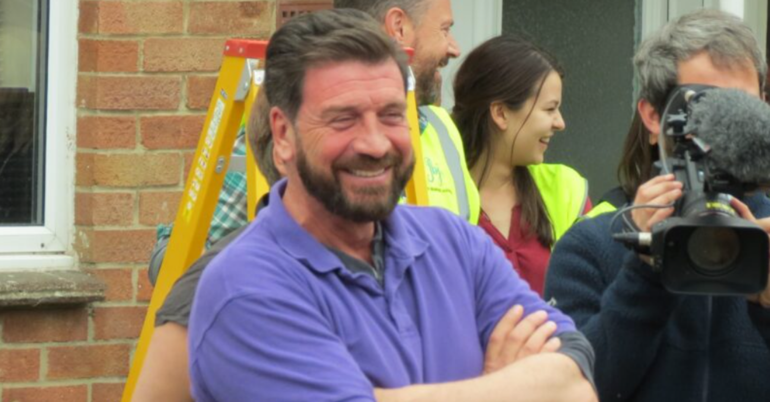 Nick Knowles smiling broadly on DIY SOS (Credit: Splash News)