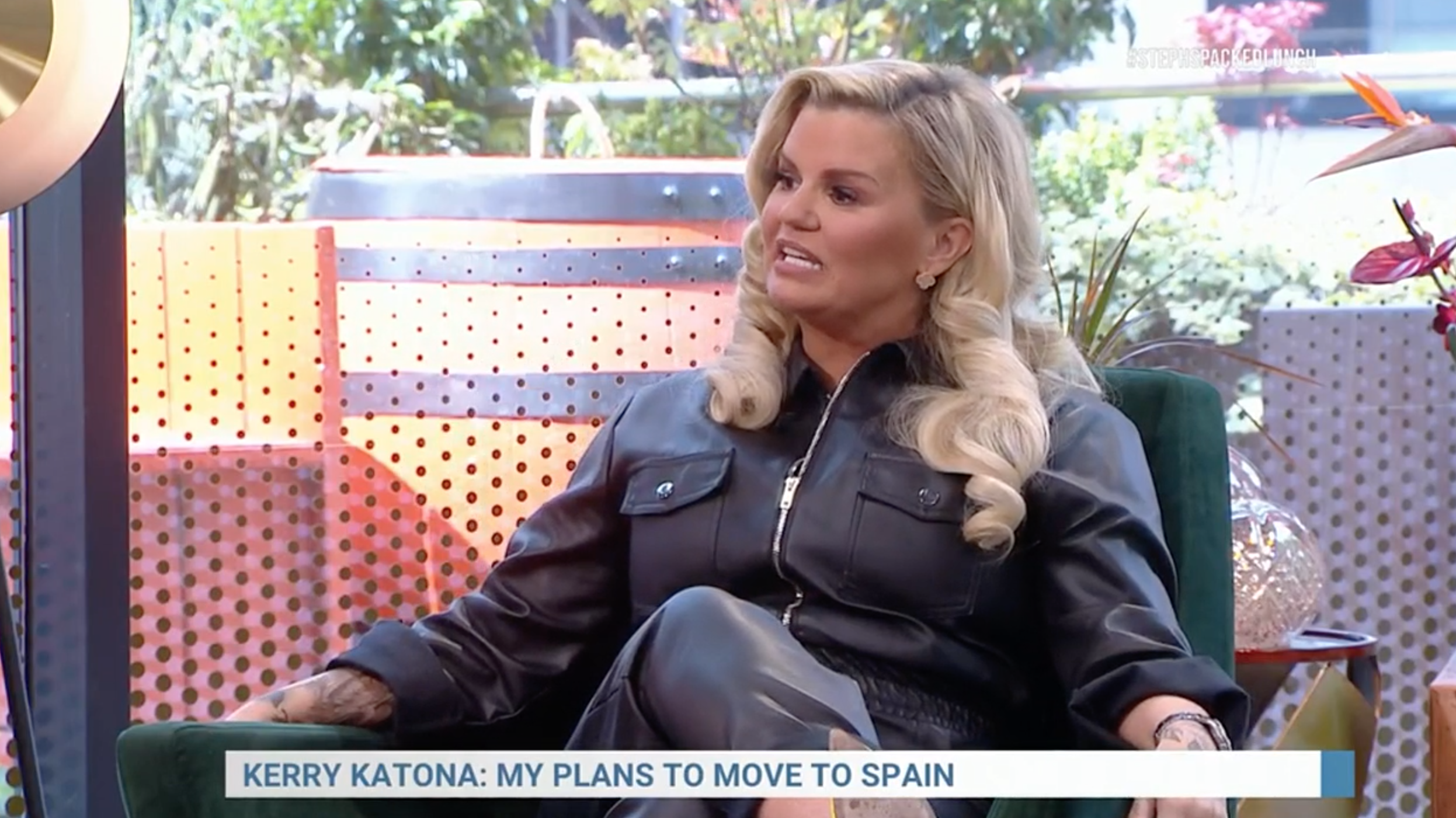 Kerry Katona wearing a black leather jacket