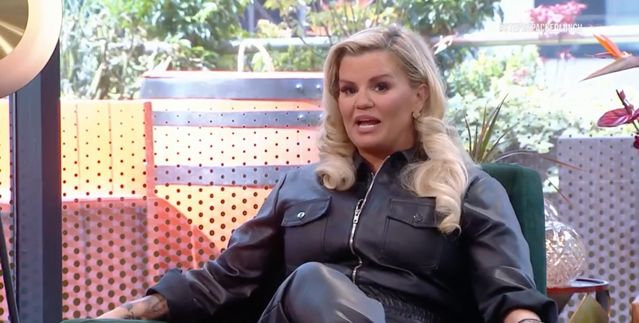 Kerry Katona wearing a black leather jacket