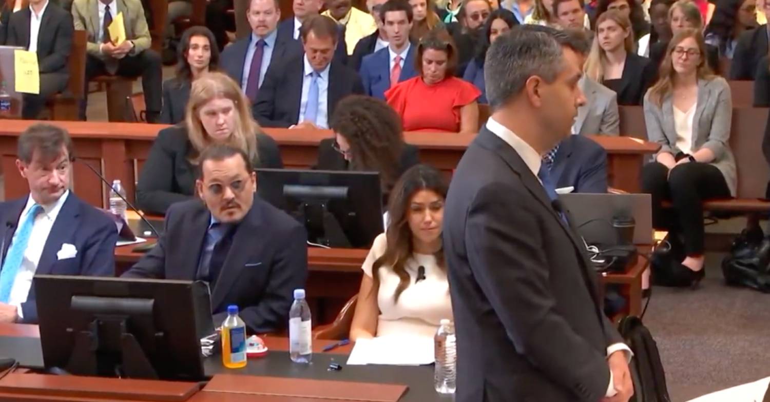 Johnny Depp looks up as Amber Heard lawyer makes his closing argument