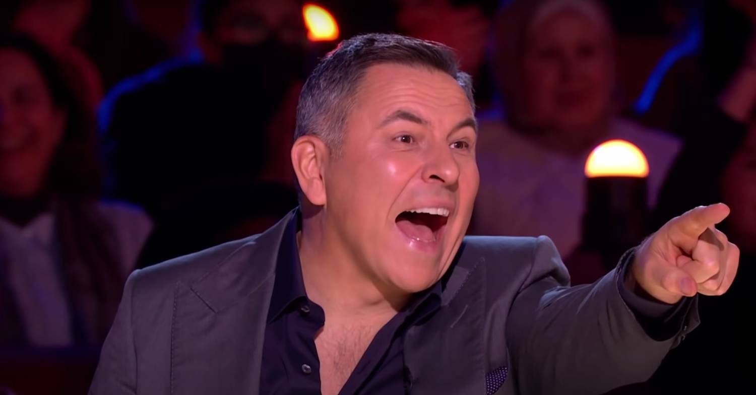 David Walliam points excitedly to the stage