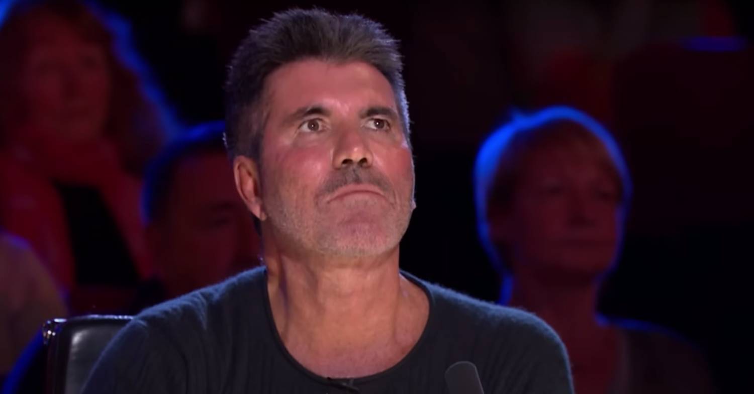 Simon Cowell looks concerned and fearful