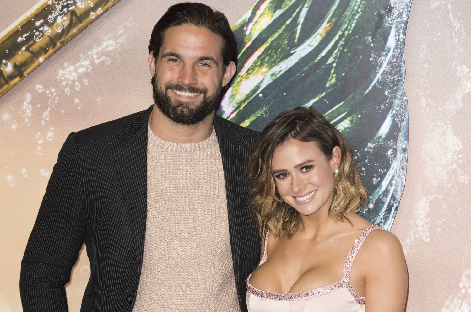 Camilla Thurlow and Jamie Jewitt smile on the red carpet
