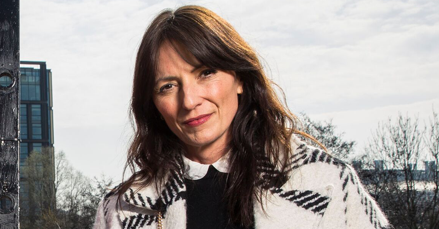 Davina McCall outside wearing a coat in winter