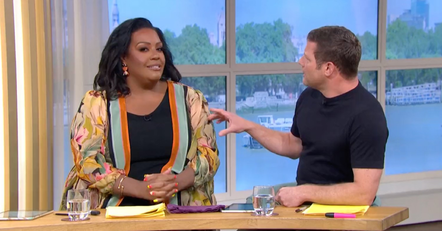 Alison Hammond giving the camera a sideways glance as Dermot O'Leary speaks to her on This Morning