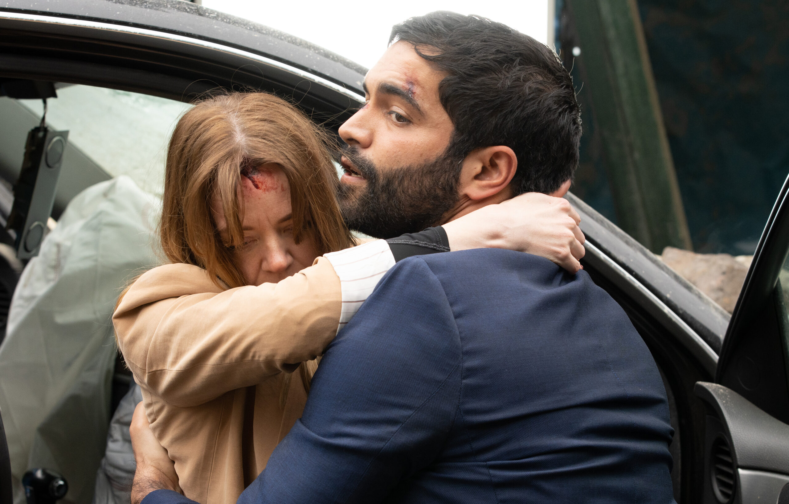 Imran helping Toyah from the car crash in Coronation Street