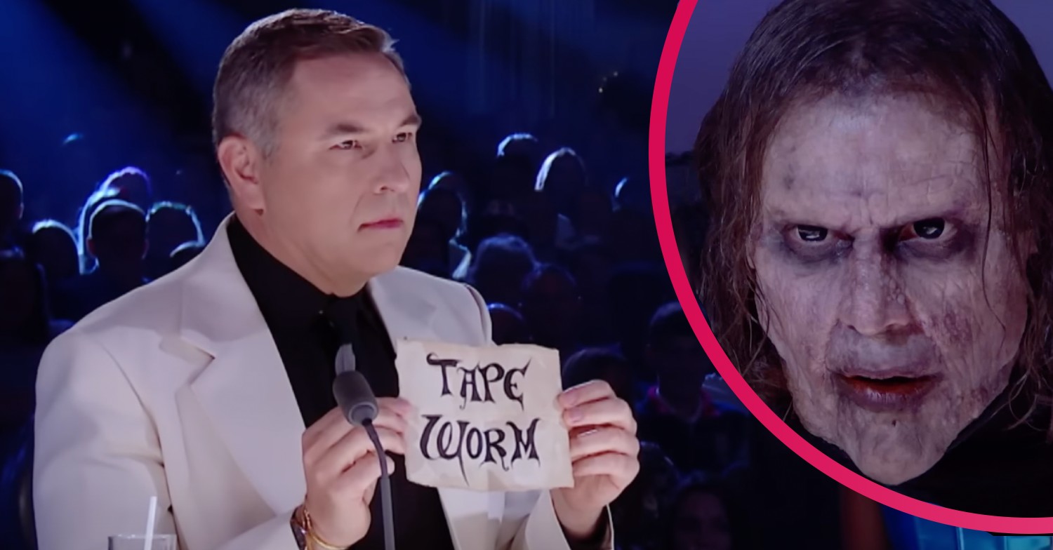 David Walliams holding up a piece of paper reading 'tape worm'. The witches on Britain's Got Talent