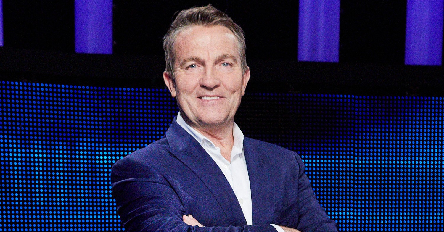 Bradley Walsh crosses arms and smiles in The Chase promo photos