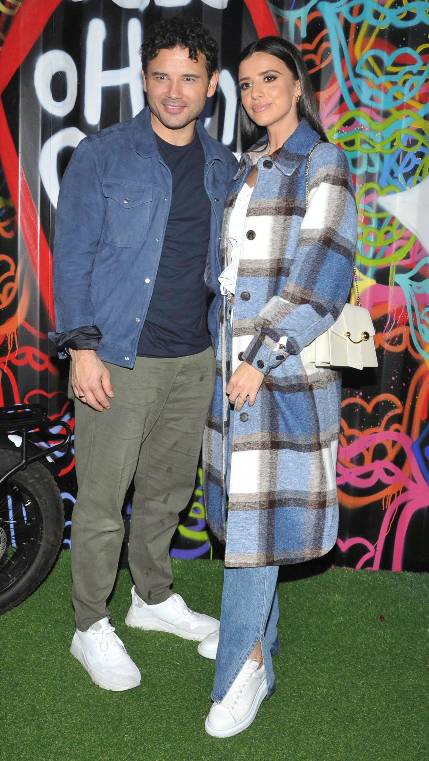 Ryan Thomas and Lucy Mecklenburgh with their arms around each other at Oh My Glaze Restaurant Launch