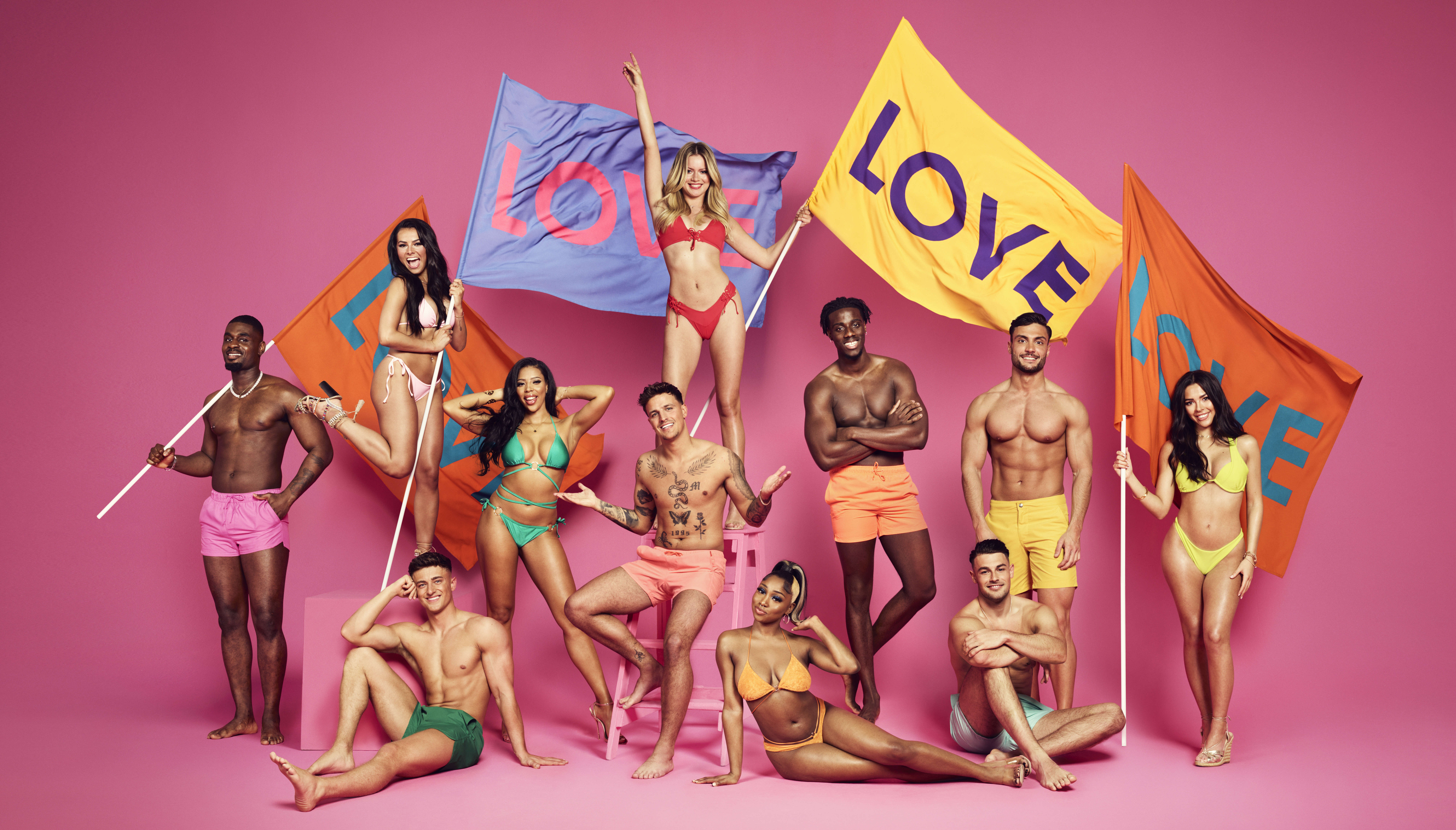 The love island 2022 cast waving flags