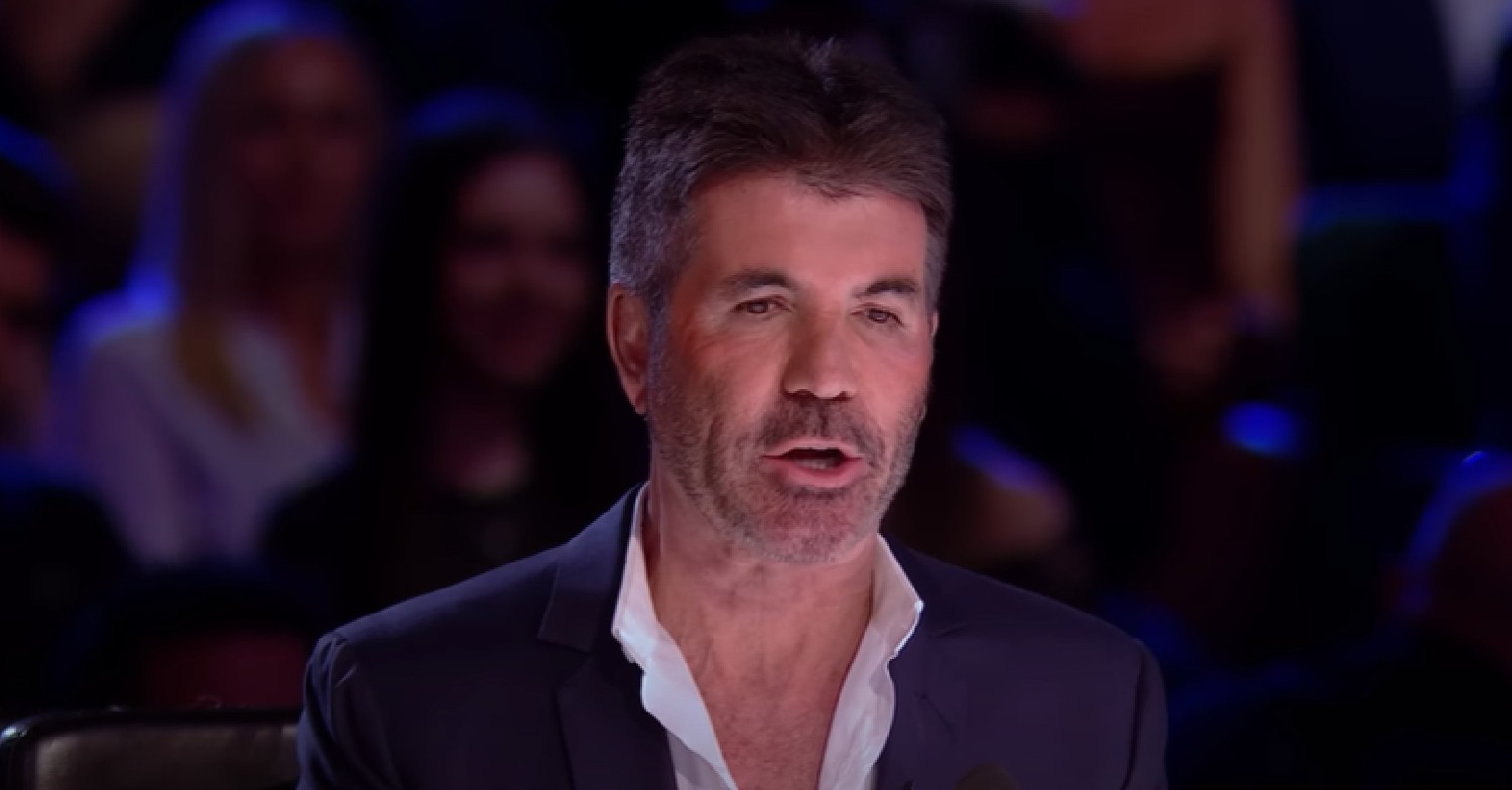 Simon Cowell looking down as he speaks during BGT final