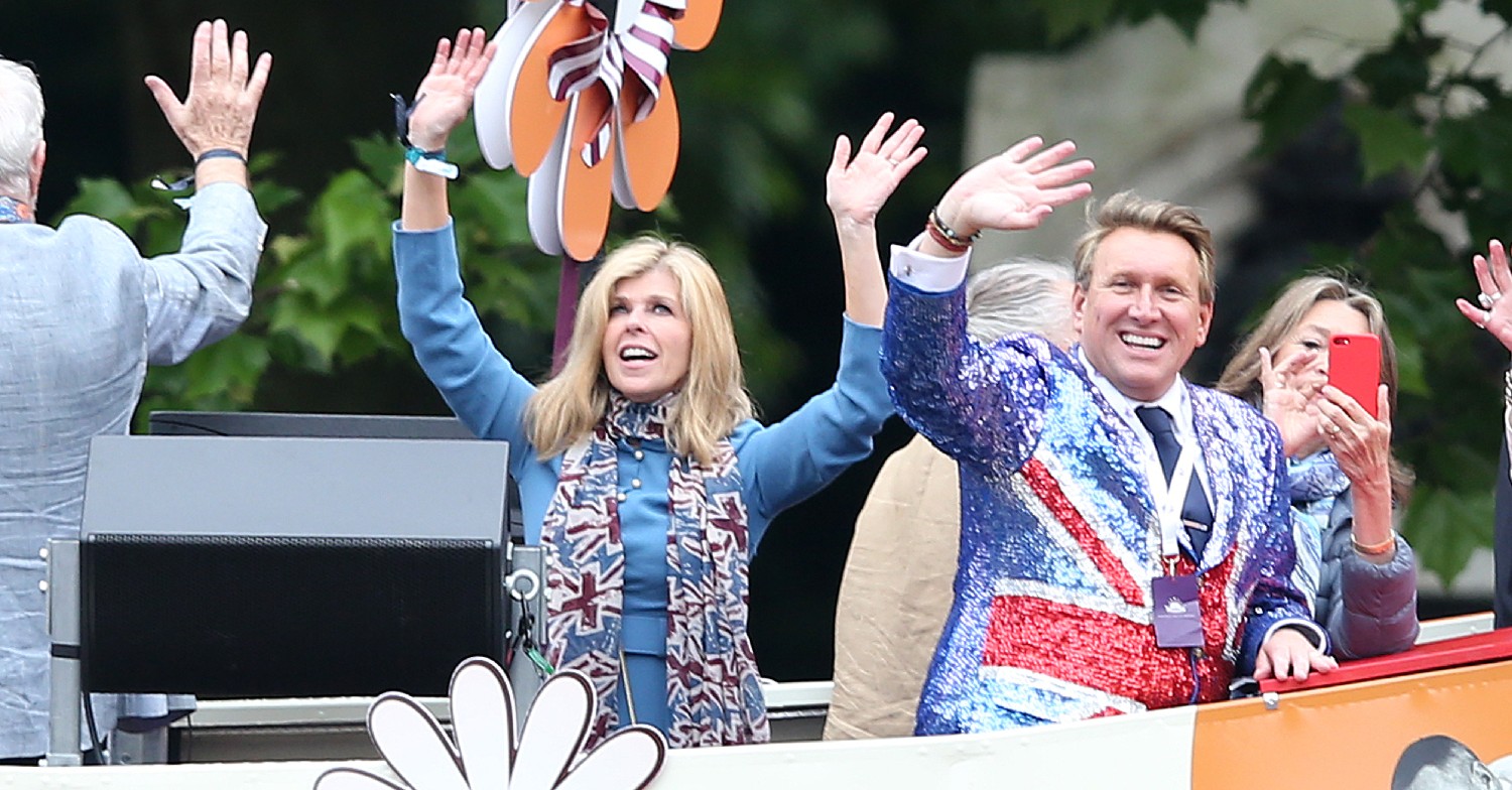 Kate Garraway waving on top of a bus during Jubilee pageant