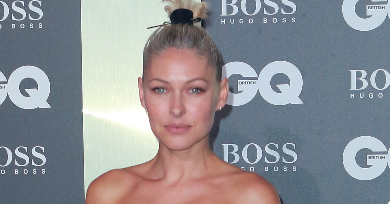 Emma Willis with her hair in a bun as she poses at GQ Awards