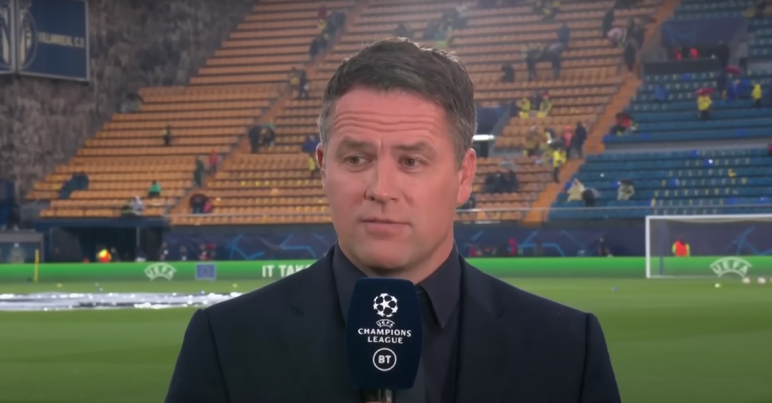 Michael Owen speaking into microphone 