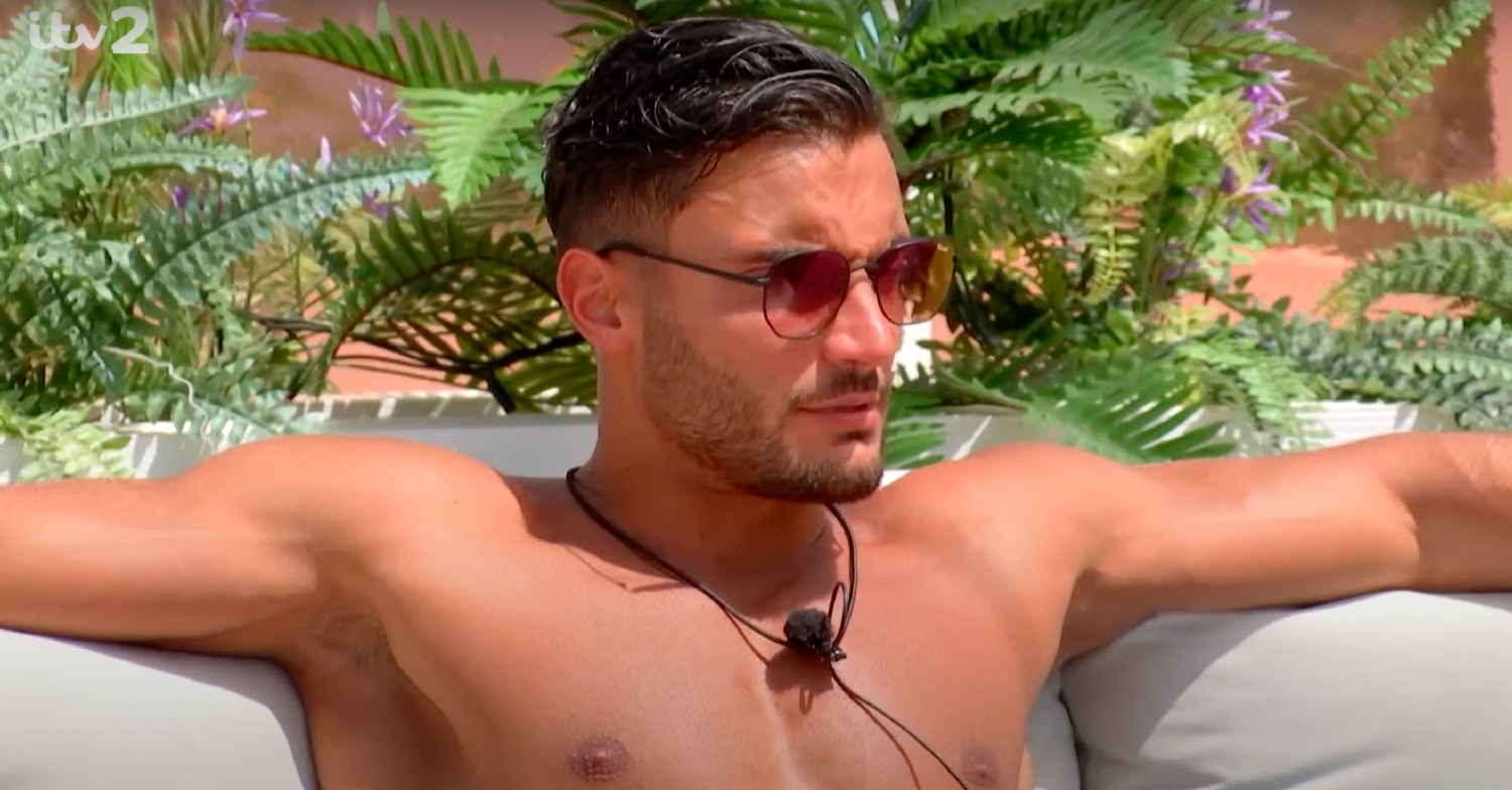 Davide shirtless with sunglasses on on Love Island 2022