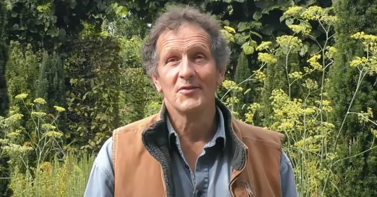 Monty Don speaking in a garden