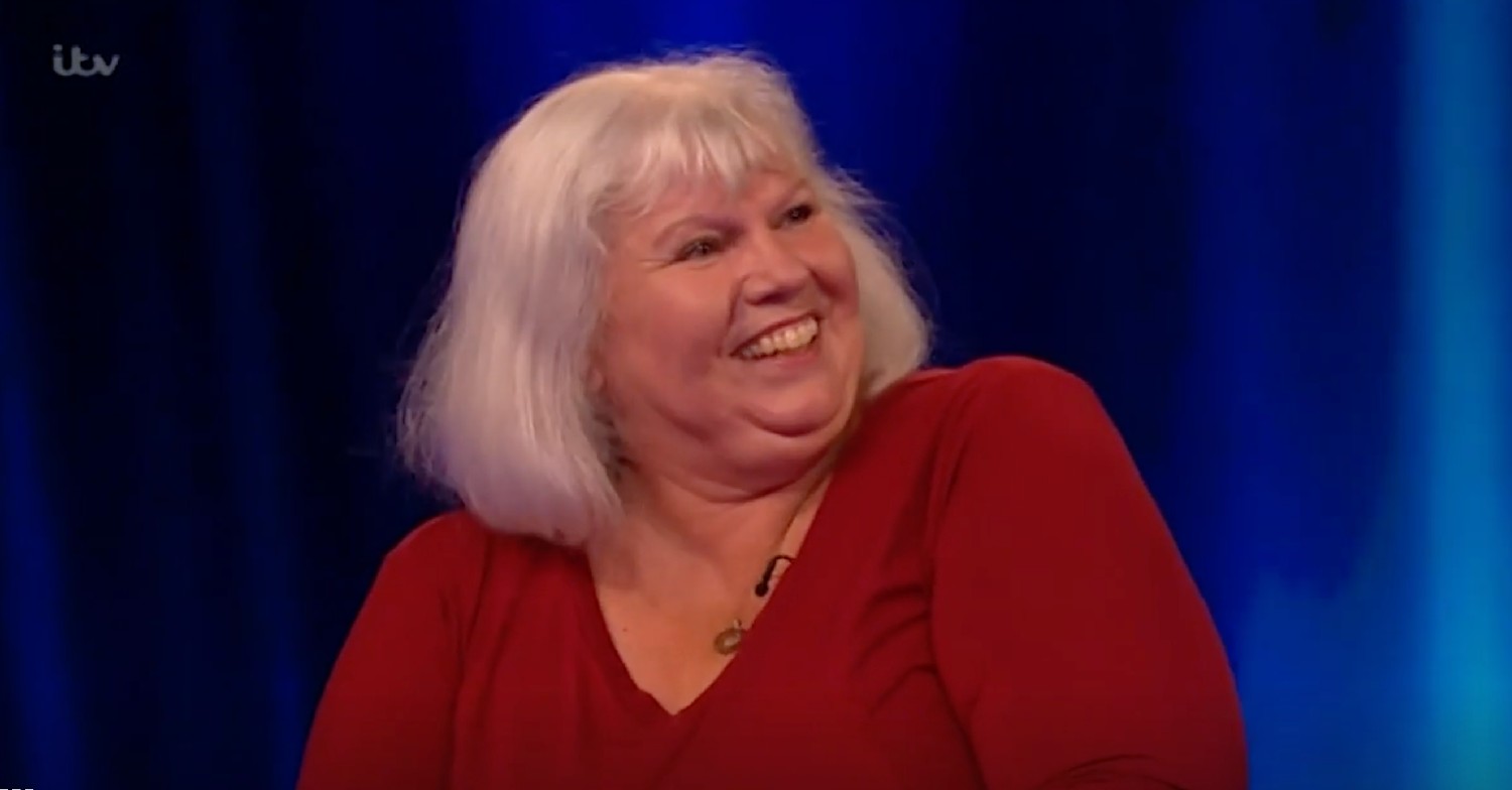 Carol smiling while turning to the side on ITV Tipping Point