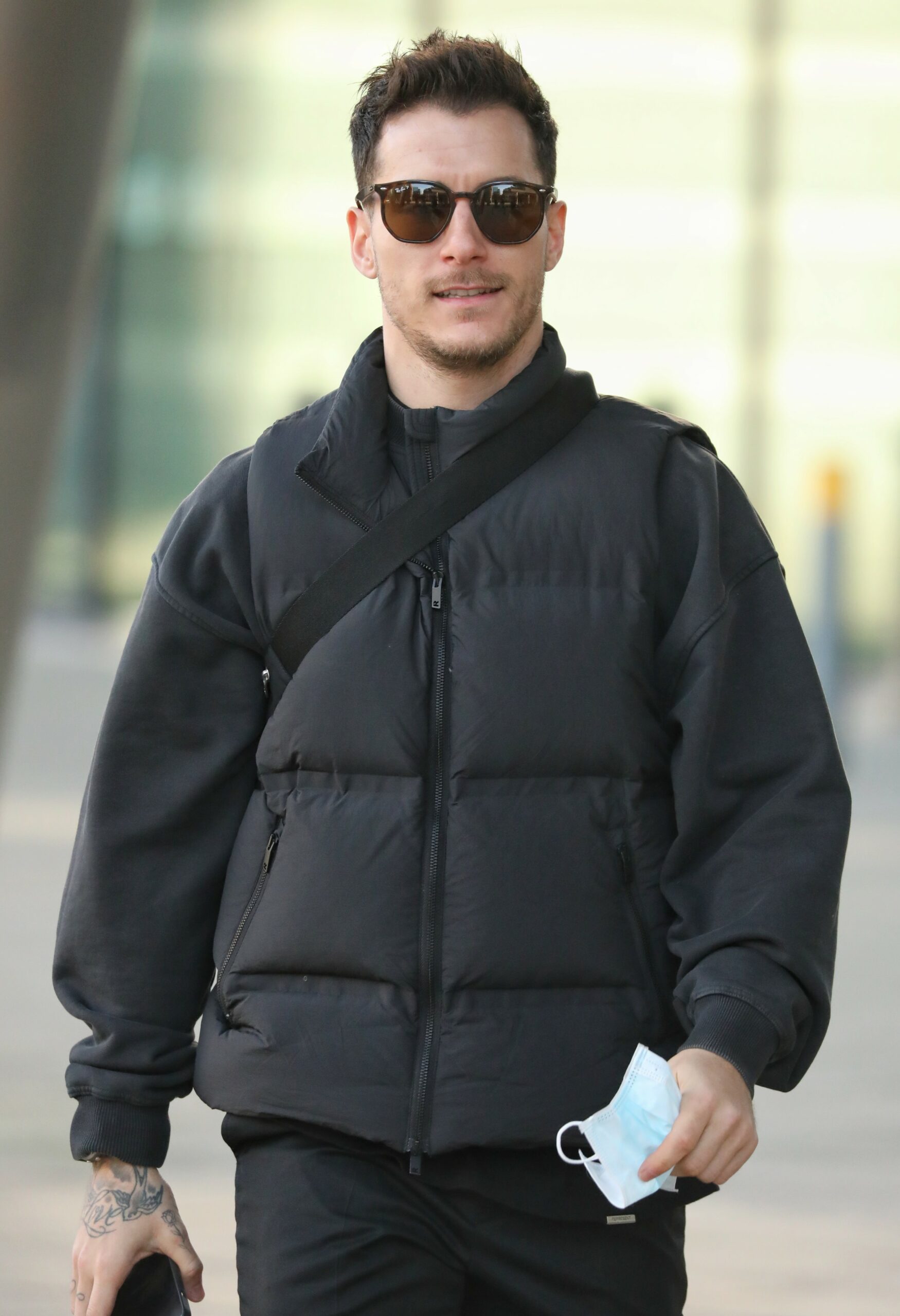 Gorka Marquez in sunglasses and puffer coat as he smiles at cameras