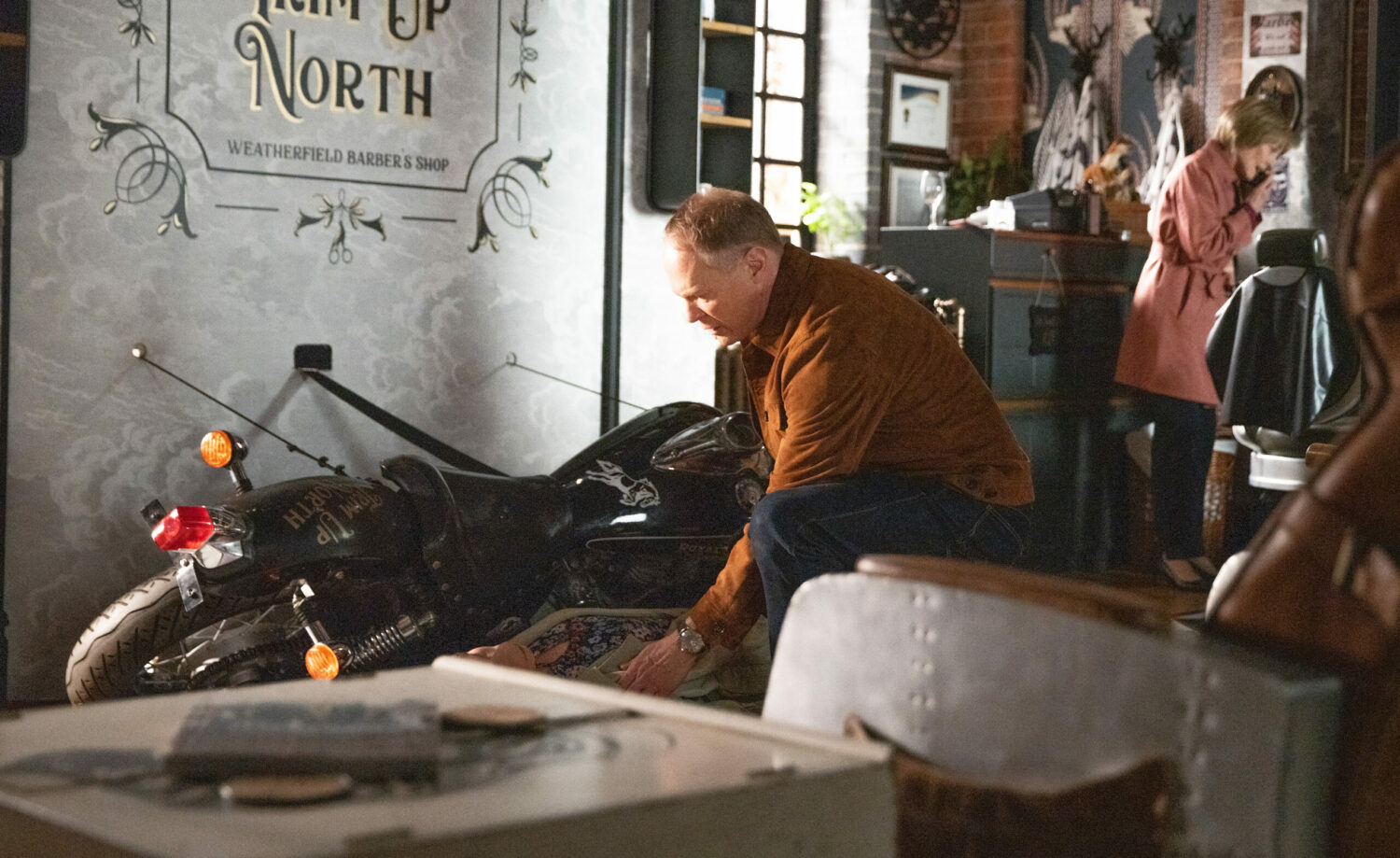 Stephen helps Audrey who is led unconscious next to a motorbike in Corrie